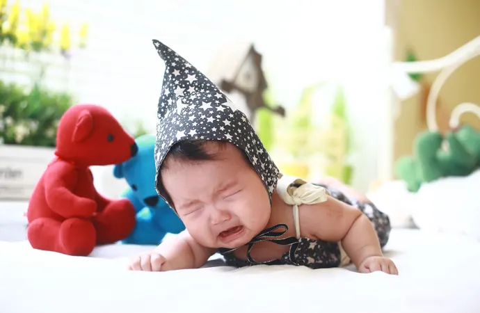 Why do babies cry when they are tired?